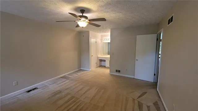 a bathroom with a toilet and a bathtub