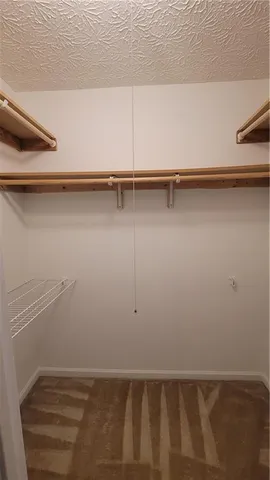 a bathroom with a toilet a sink and shower