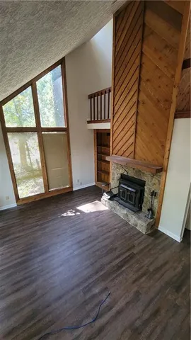 a kitchen with a refrigerator a stove a sink dishwasher and wooden floor