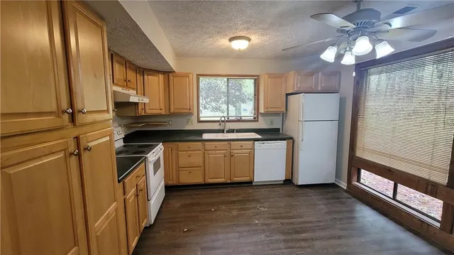 a view of a livingroom with wooden floor