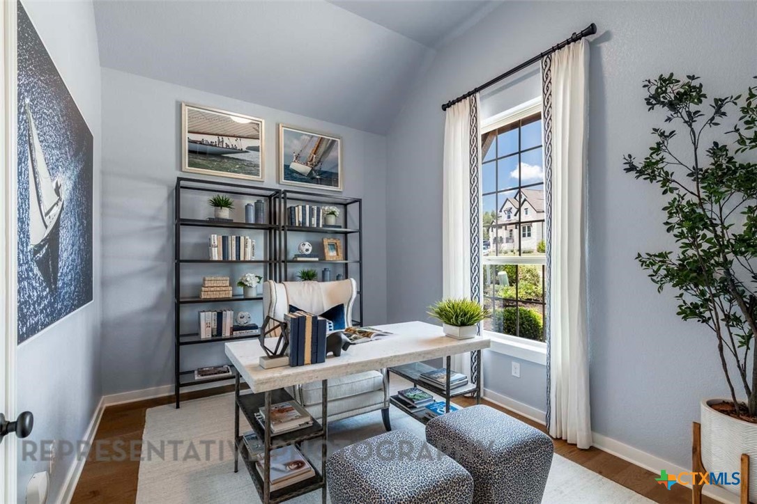 840 Jackson River Loop Kyle, TX 78640 - Photo 16 of 31 a workspace with furniture and a potted plant