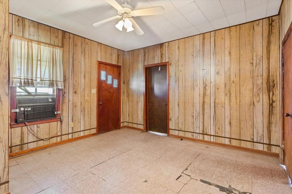 100 County Road 120 C Riesel, TX 76682 - Photo 4 of 25 Entryway with wooden walls, tile patterned floors, and a ceiling fan