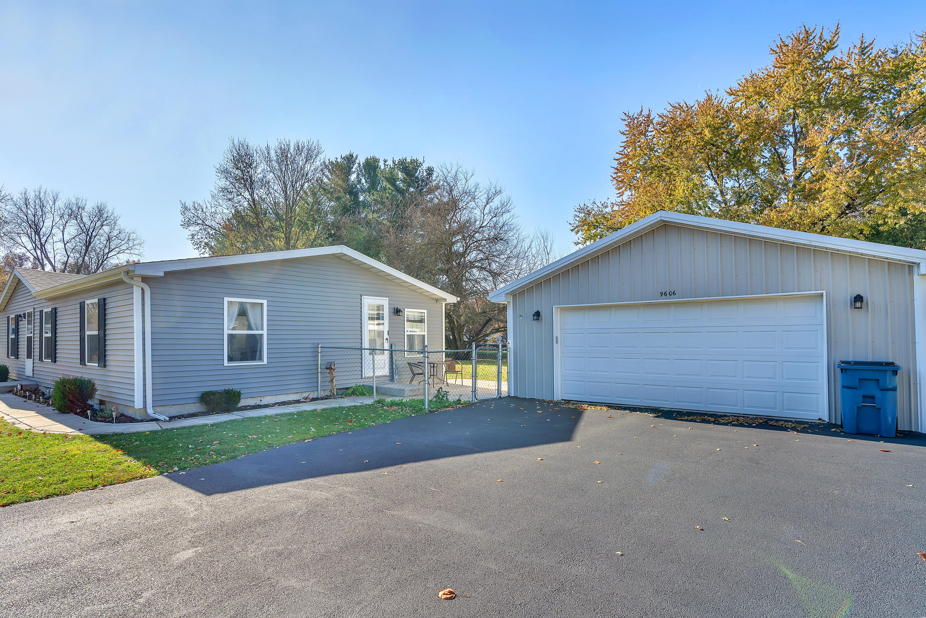 9606 Candlewick Road West Demotte, IN 46310 - Photo 2 of 18 a front view of house with yard and trees all around