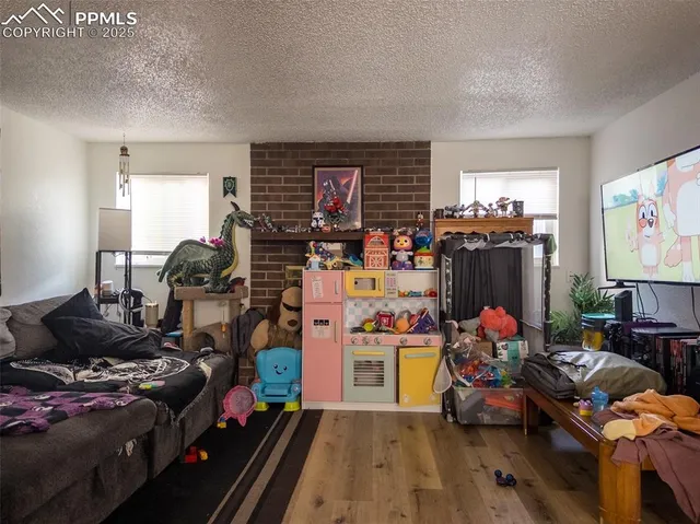 a living room with lots of furniture and a flat screen tv