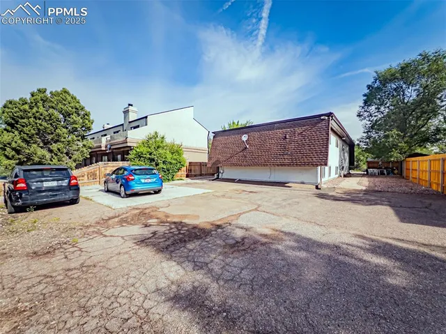 a view of a car parked in front of a house