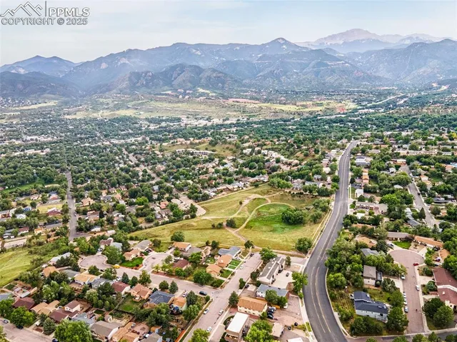 an aerial view of residential house and green space