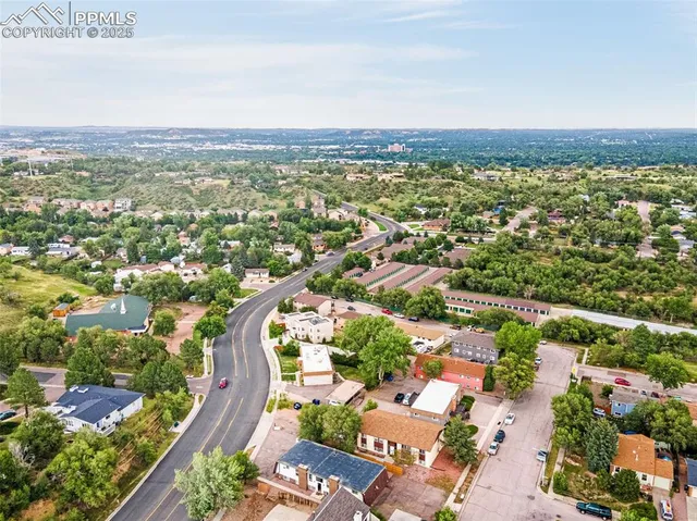 an aerial view of residential houses with outdoor space