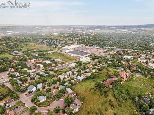 an aerial view of residential building and green space