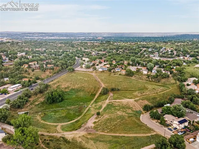 an aerial view of residential houses with outdoor space