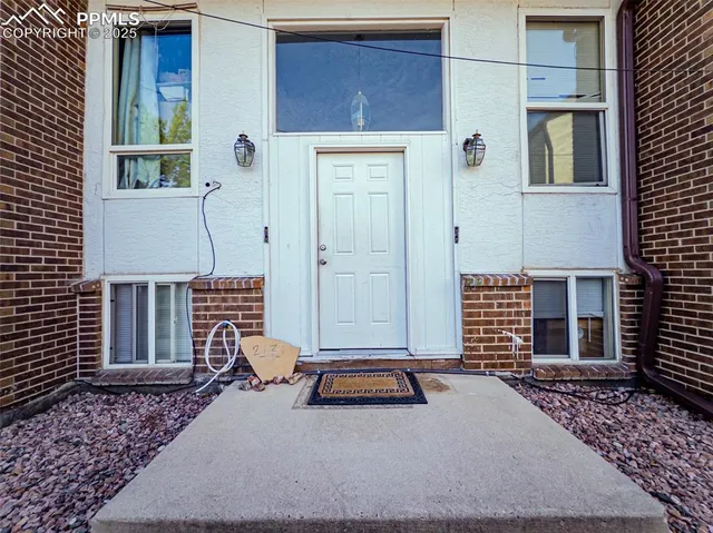 a backyard of a house with barbeque oven