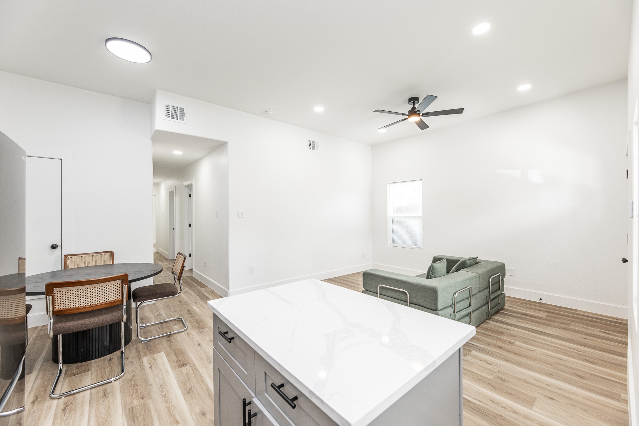 9727 Stedman Street Houston, TX 77029 - Photo 3 of 23 Its open-concept design seamlessly connects to the living and dining areas, creating the perfect space for everyday living and entertaining