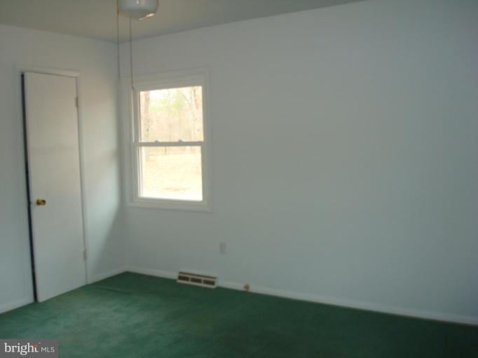22542 Old Rolling Road California, MD 20619 - Photo 12 of 27 Bedroom with a half bath