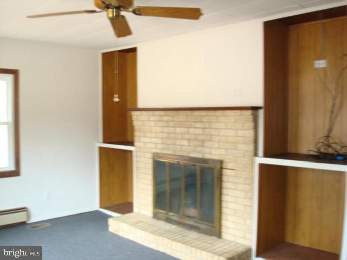 22542 Old Rolling Road California, MD 20619 - Photo 24 of 27 Nice Brick wood burning fireplace