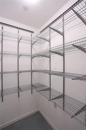 655 East 2nd Street, Unit 209 Boston, MA 02127 - Photo 4 of 16 a view of a room with rack on the wall and a window