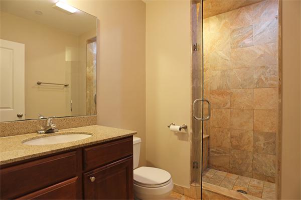 655 East 2nd Street, Unit 209 Boston, MA 02127 - Photo 8 of 16 a bathroom with a granite countertop sink toilet and shower