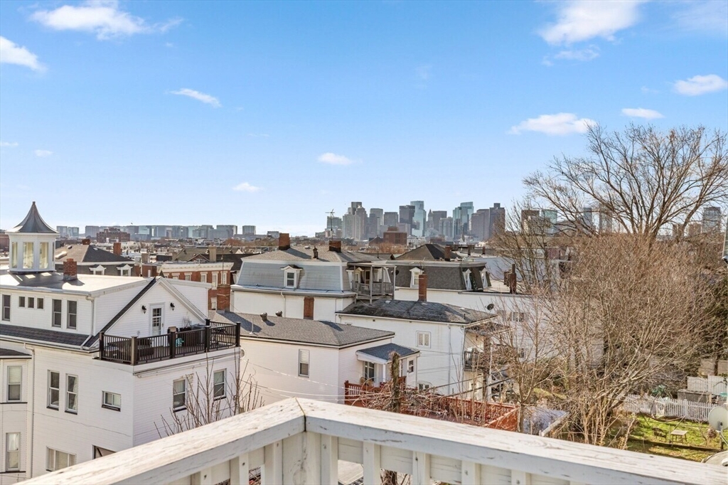 167 Lexington Street, Unit 167 Boston, MA 02128 - Photo 13 of 34 a view of a city with tall buildings