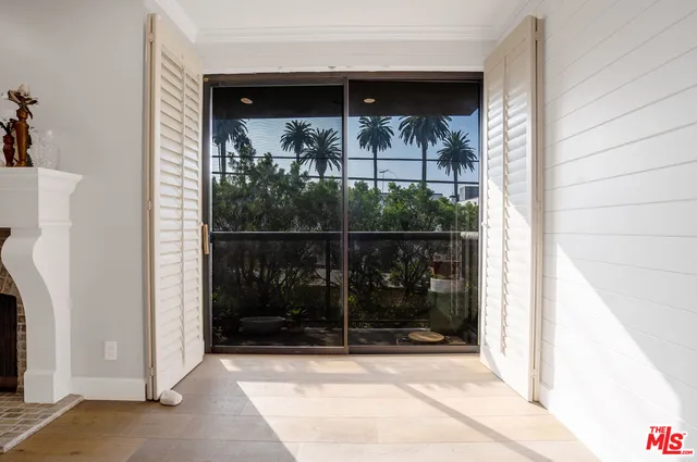 a view of a glass door and a window