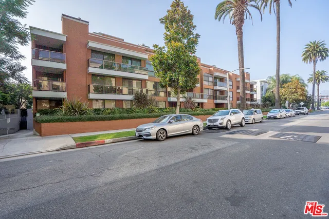 a view of a street with cars