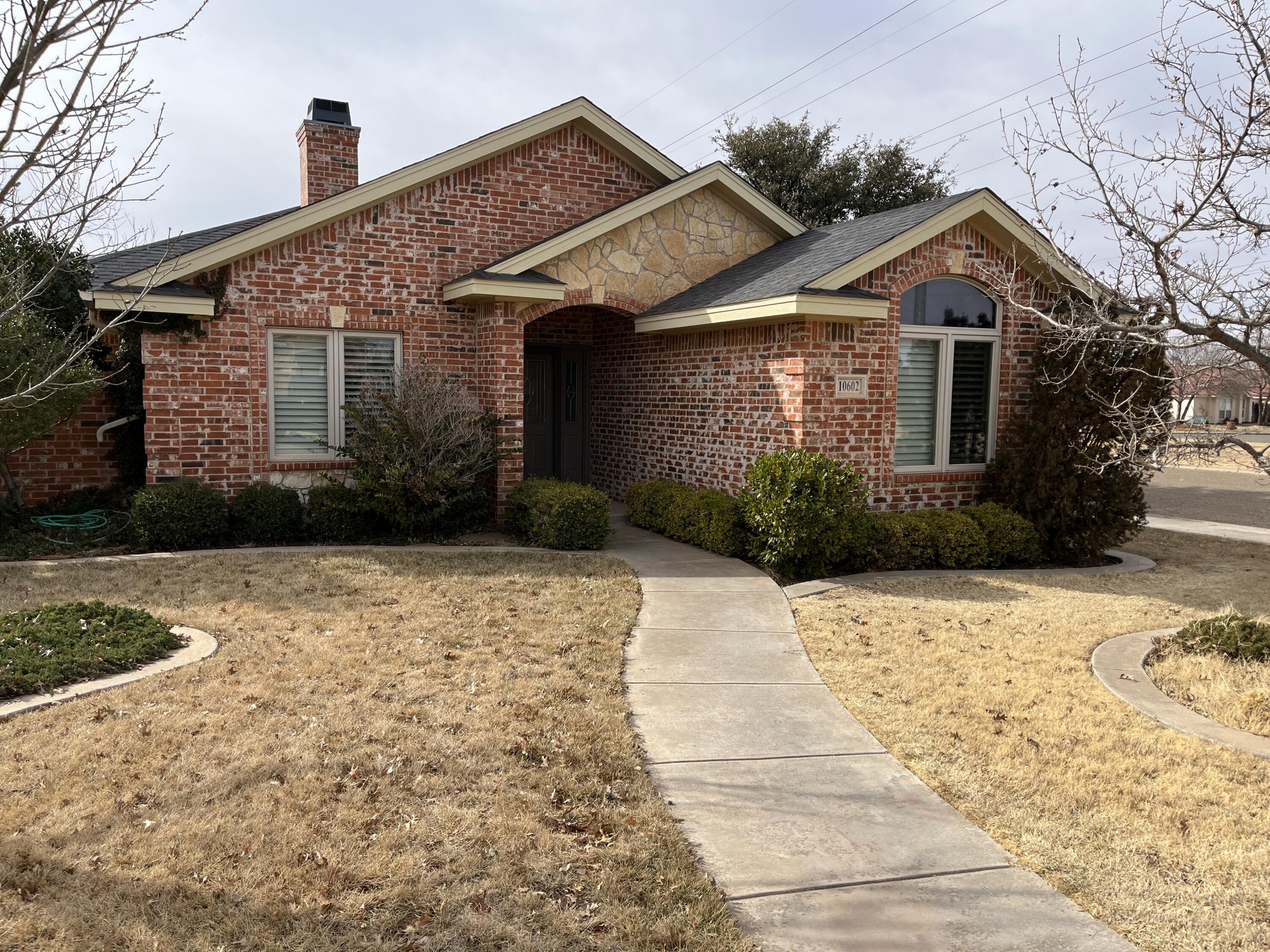 10602 Wayne Avenue Lubbock, TX 79424 - Photo 1 of 17 a front view of a house with a yard