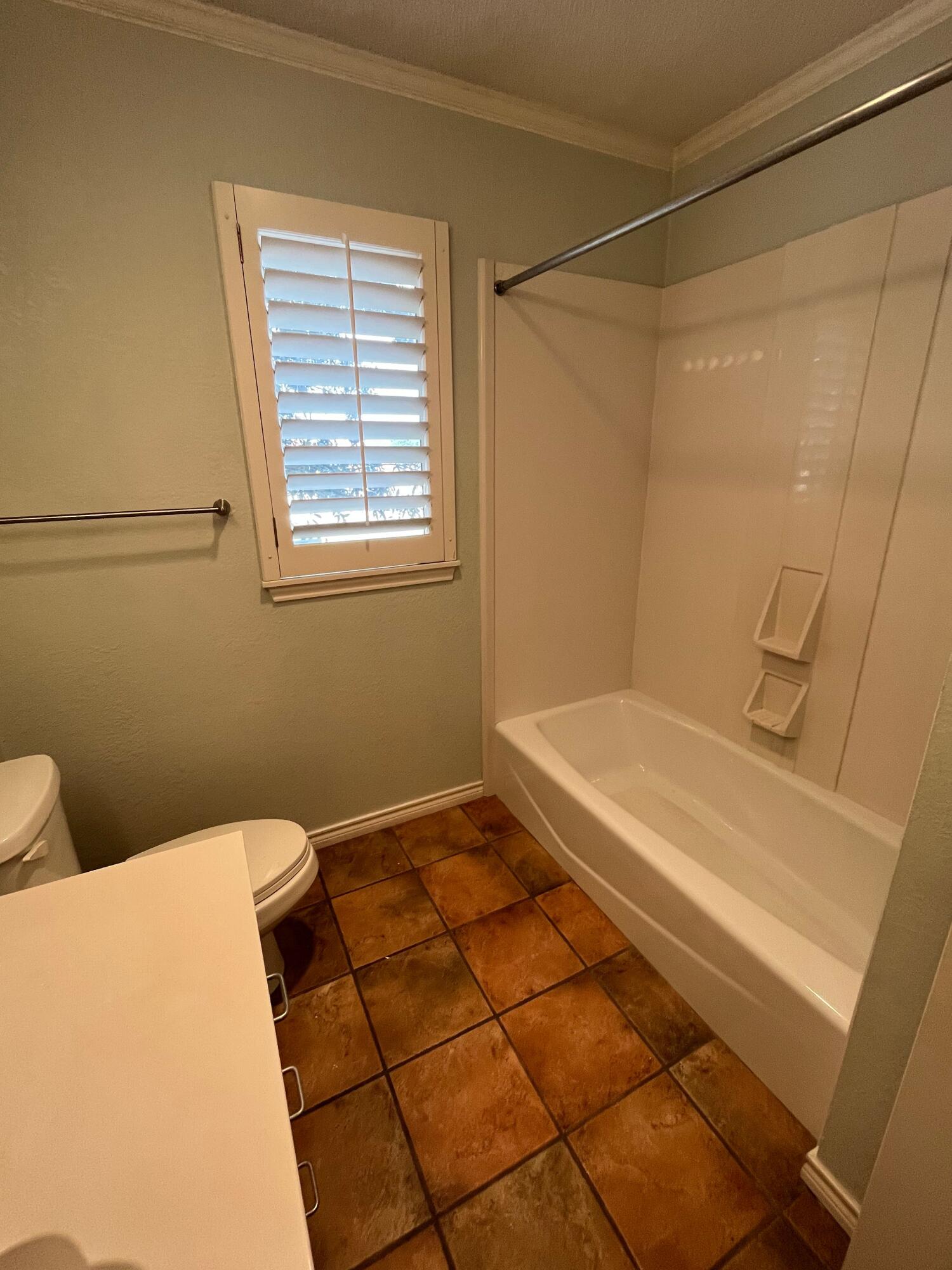 10602 Wayne Avenue Lubbock, TX 79424 - Photo 12 of 17 a bathroom with a sink and a vanity