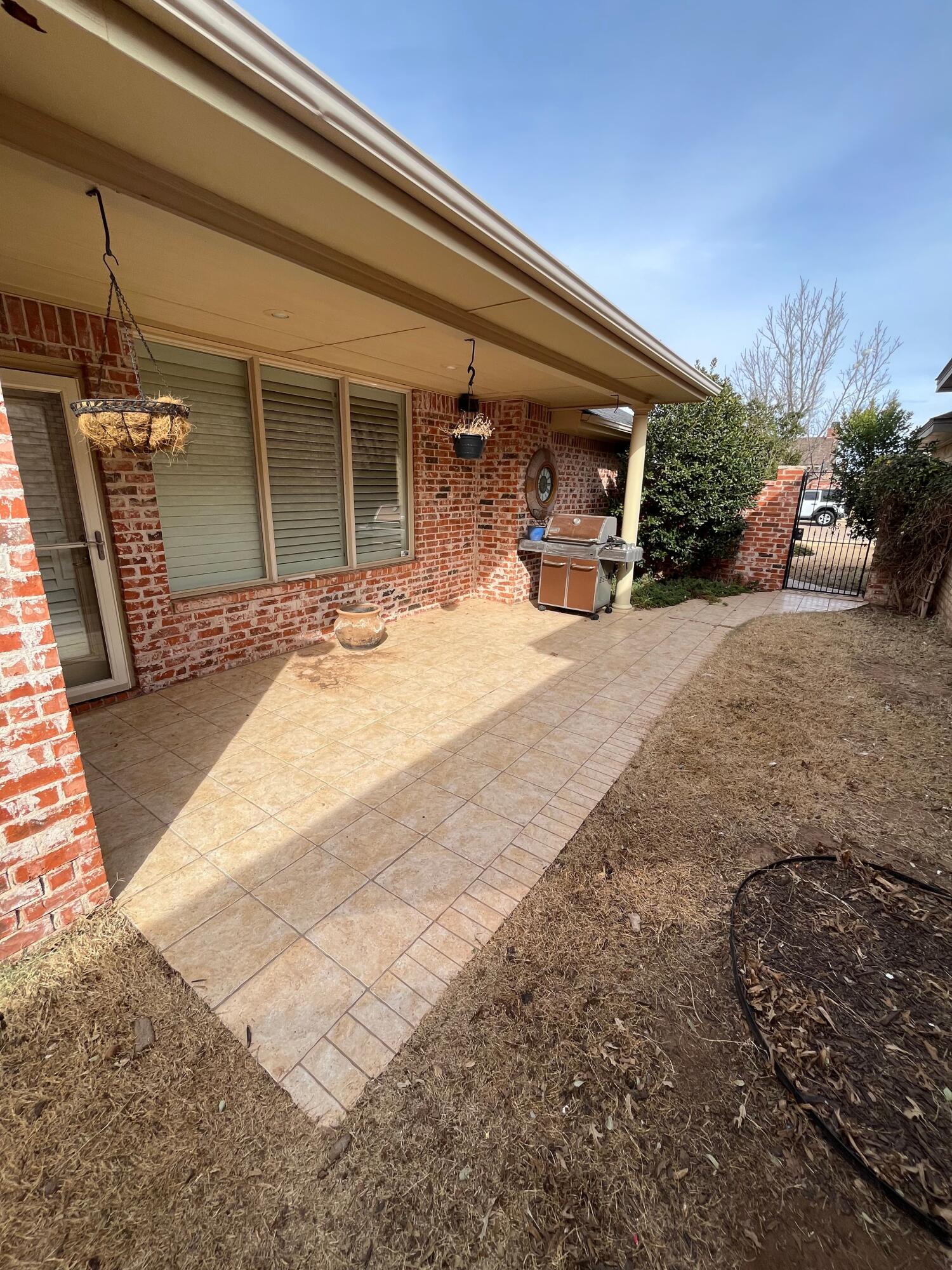 10602 Wayne Avenue Lubbock, TX 79424 - Photo 16 of 17 a view of a house with outdoor space and porch