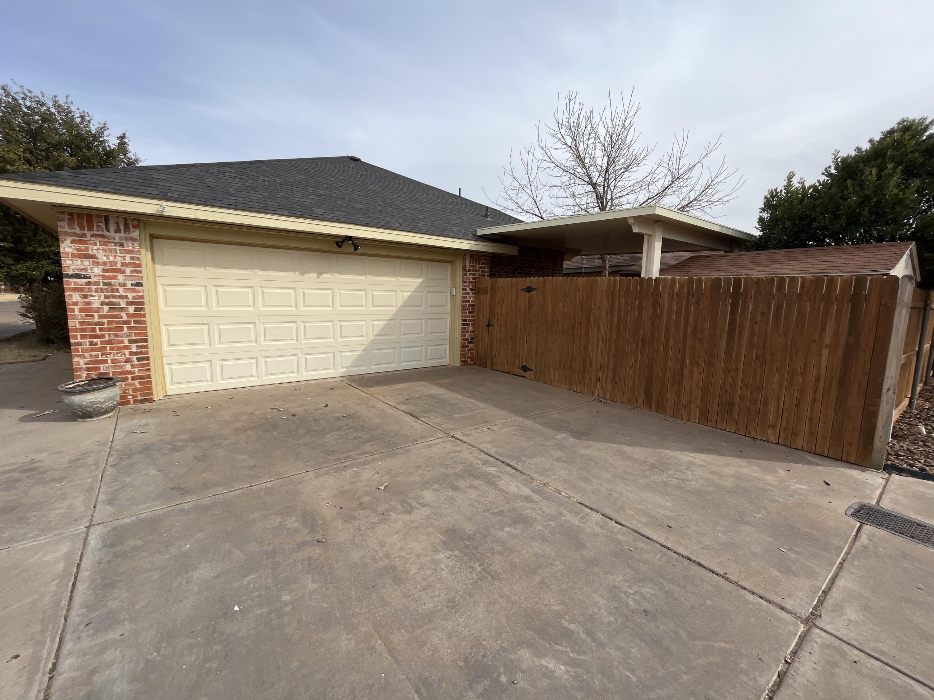10602 Wayne Avenue Lubbock, TX 79424 - Photo 17 of 17 a front view of house with a garage