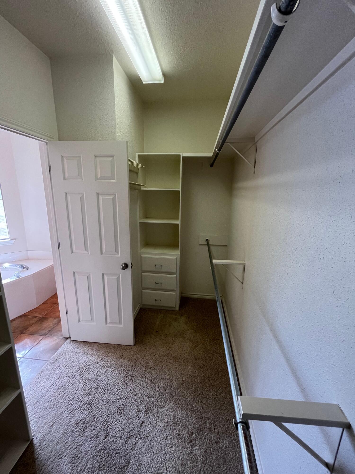 10602 Wayne Avenue Lubbock, TX 79424 - Photo 9 of 17 a view of an empty room with a staircase