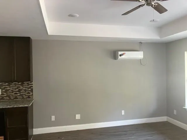 a view of a room with hardwood floor