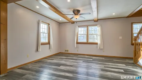 a view of an entryway with wooden floor