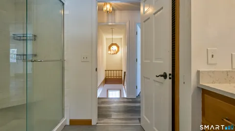 a bathroom with a double vanity sink and mirror