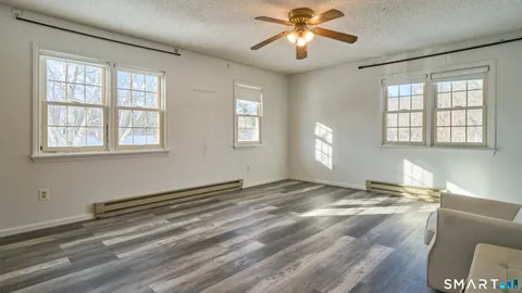 a view of an entryway door and hallway