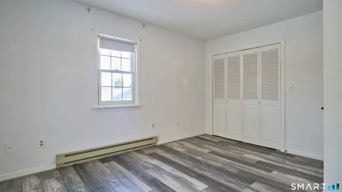 a view of an empty room with closet