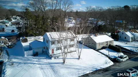 a view of a patio with table and chairs