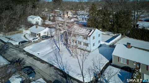 a view of a livingroom with furniture and wooden floor