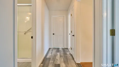 a view of a bathroom from a hallway