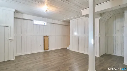an empty room with wooden floor