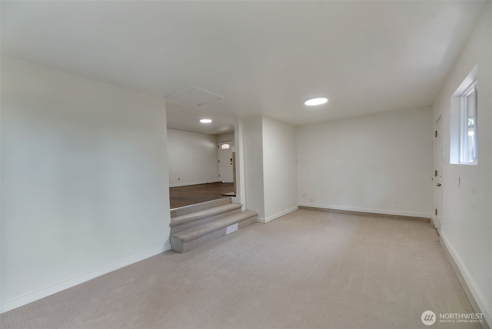 11229 29th Avenue Southwest Seattle, WA 98146 - Photo 6 of 28 an empty room with a kitchen