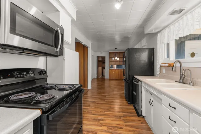a kitchen with a stove and a microwave