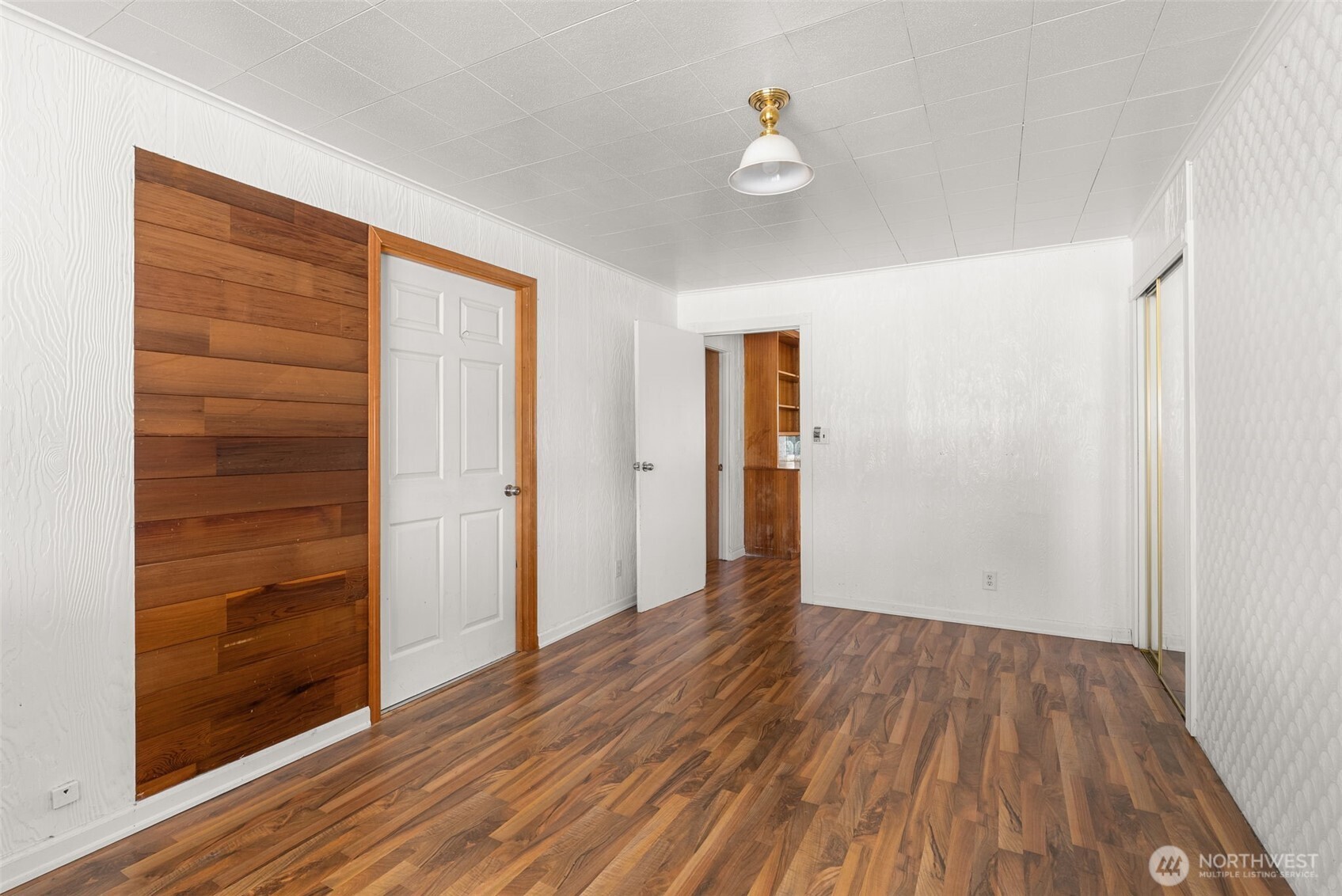 402 North 10th Street Elma, WA 98541 - Photo 21 of 35 a view of an empty room with wooden floor
