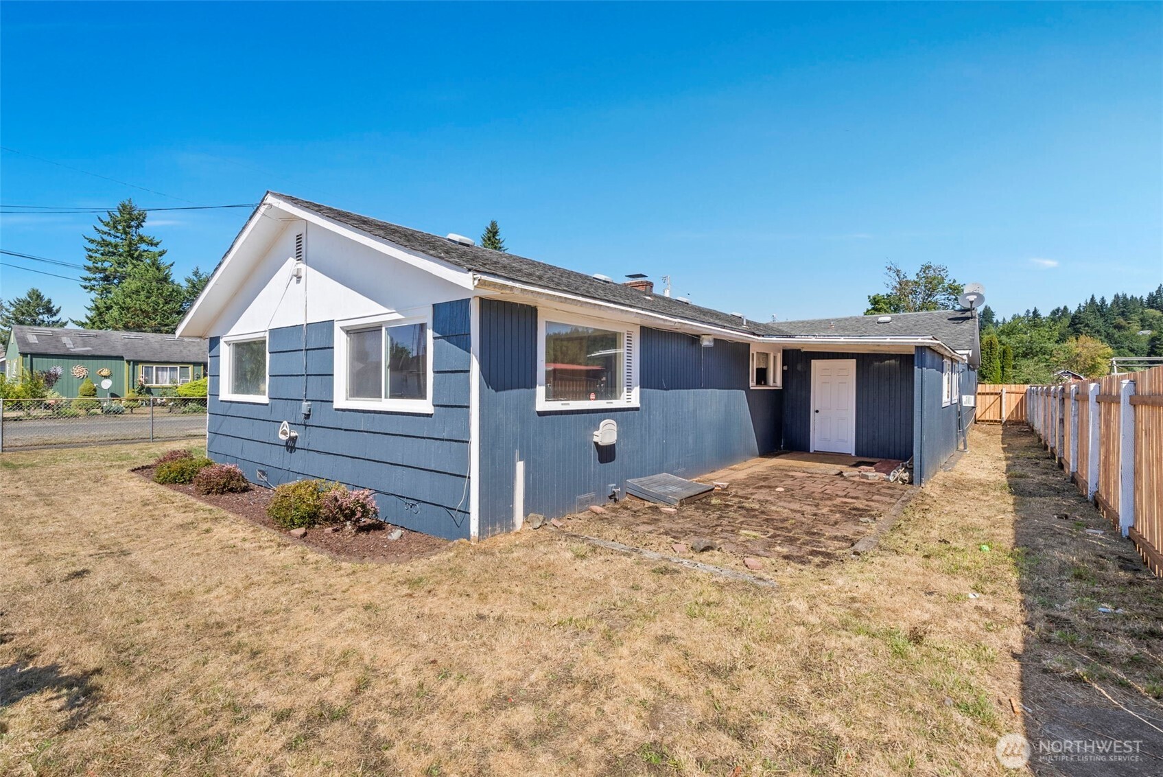 402 North 10th Street Elma, WA 98541 - Photo 31 of 35 a front view of house with yard outdoor seating and barbeque oven