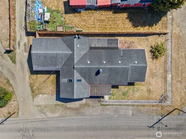 an aerial view of a house with a swimming pool