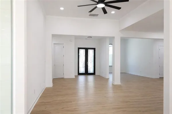 a kitchen with stainless steel appliances and white cabinets