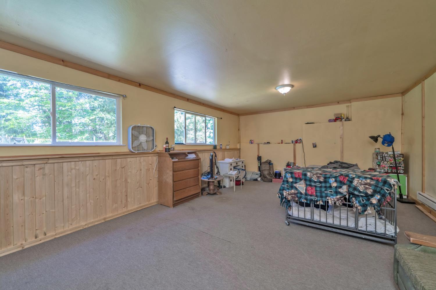 6929 Split Bend Road Pollock Pines, CA 95726 - Photo 32 of 38 a living room with furniture and a large window