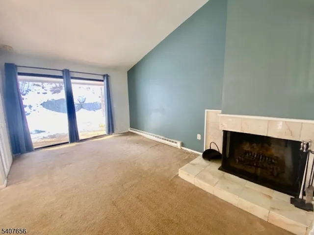 a bedroom with a bed and a fireplace