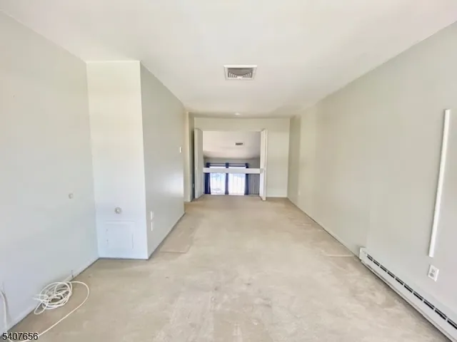 a view of a livingroom and a hallway