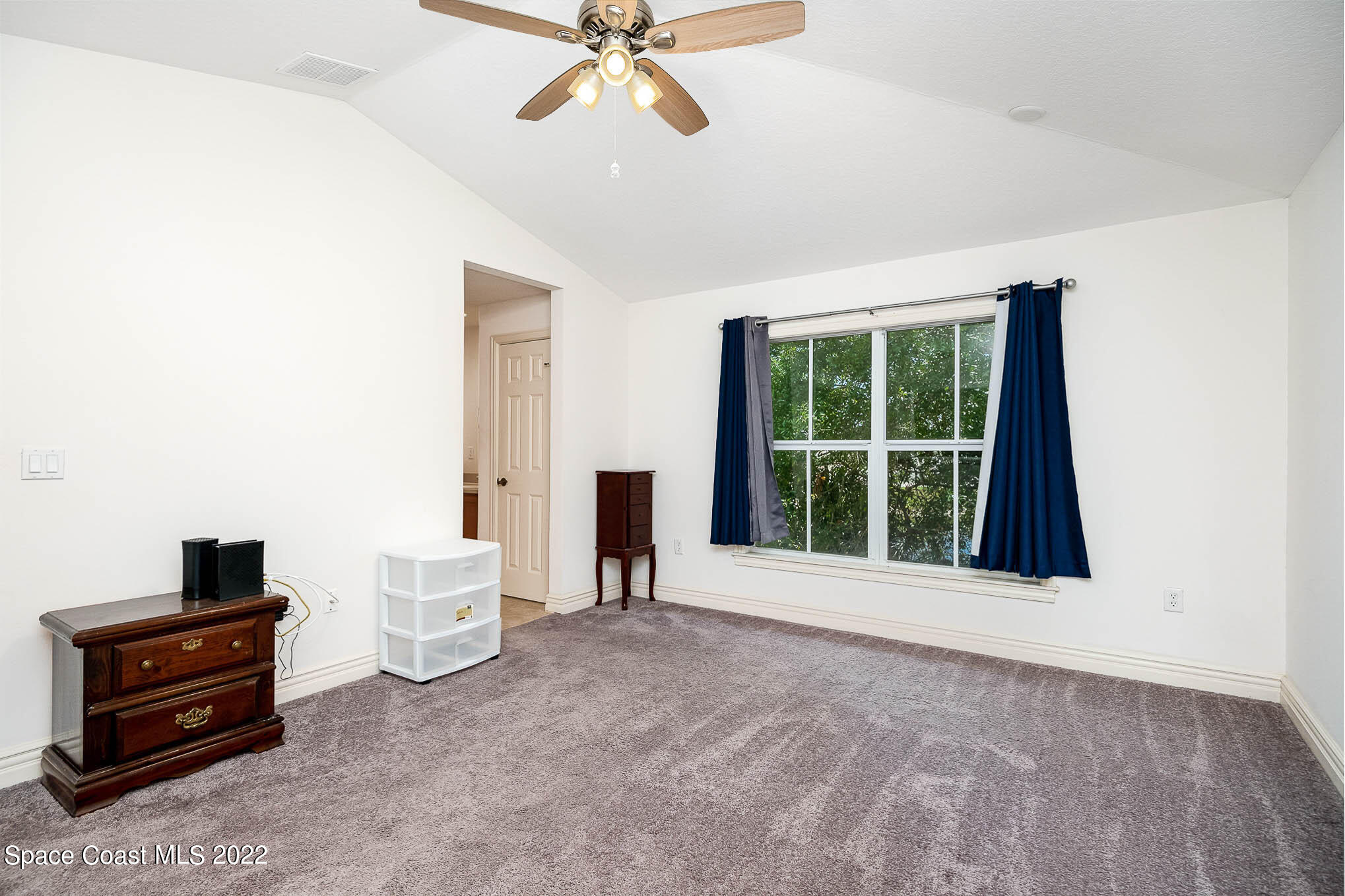 634 Cedar Side Circle Northeast Palm Bay, FL 32905 - Photo 14 of 24 a view of an empty room with a window
