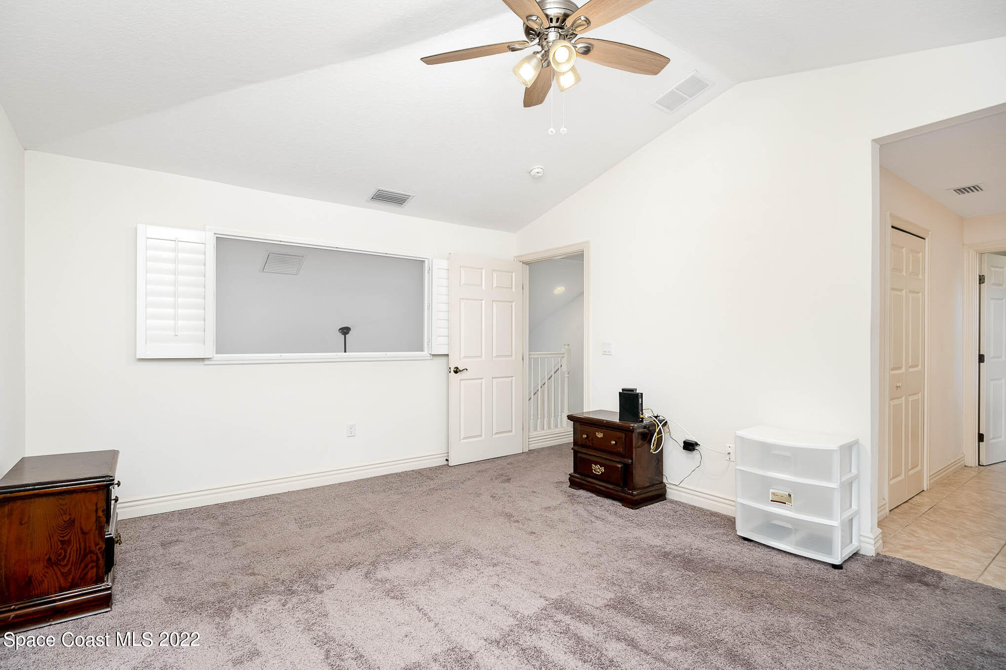 634 Cedar Side Circle Northeast Palm Bay, FL 32905 - Photo 15 of 24 a living room with furniture and a chandelier