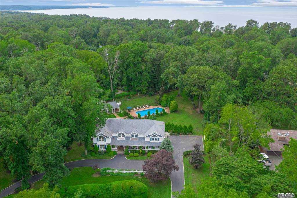 530 Long Beach Road Nissequogue, NY 11780 - Photo 1 of 1 an aerial view of a house with pool outdoor seating and yard
