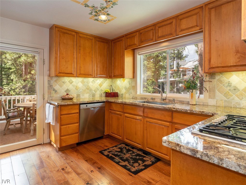 338 Woodridge Way Incline Village, NV 89451 - Photo 5 of 16 a kitchen with stainless steel appliances granite countertop a stove a sink and a refrigerator
