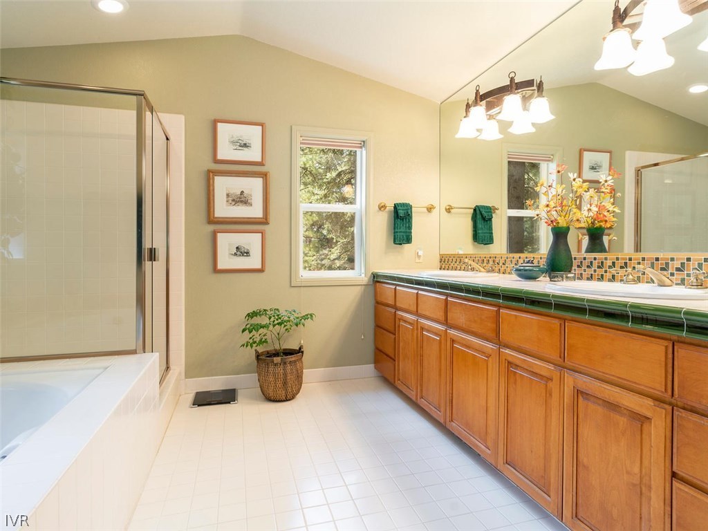 338 Woodridge Way Incline Village, NV 89451 - Photo 8 of 16 a spacious bathroom with a granite countertop sink mirror and a